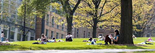 Students pass the Law School on snowy Bascom Hill.