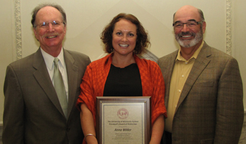 Anne Bilder receives President's Award of Dictinction from UW System President Kevin Reilly (at left) and Board of Regents President Michael Falbo.