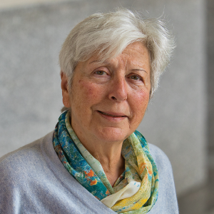 Marina Ottaway Photo of Marina Ottaway, a senior woman with light skin, short white hair. She is wearing a sweater with a colorful scarf.