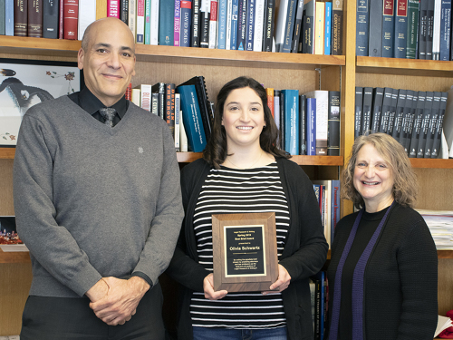 Andrew Taylor and Dean Raymond present Olivia Schwartz with the Best Brief award