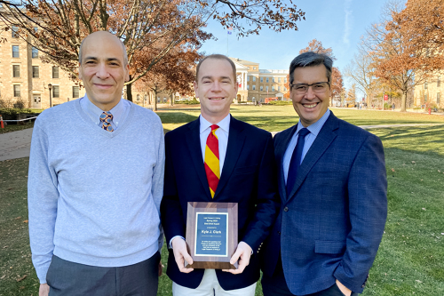 LRW professor andrew turner, winner kyle clark, and dean daniel tokaji on bascom hill