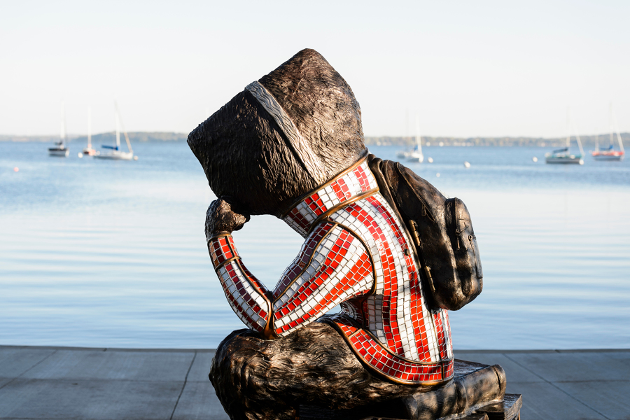 pensive bucky statue at alumni park by lake monona